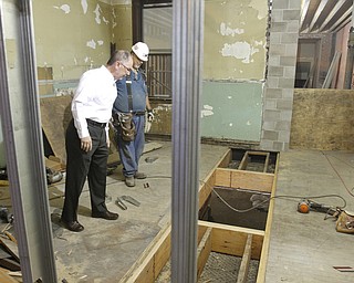        ROBERT K. YOSAY  | THE VINDICATOR..David Nestic...  with David Urichich check out where a heating and cooling  duct work will be installed...Warrens' TECH belt energy innovation center on  courthouse square, right  next door to the Wean Foundation offices..the old Kresge'  business...-30-
