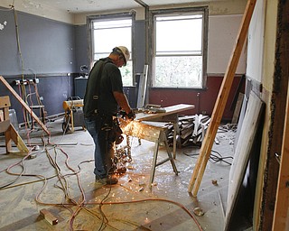        ROBERT K. YOSAY  | THE VINDICATOR..Cutting part of the HVAC.. David Urichich......Warrens' TECH belt energy innovation center on  courthouse square, right  next door to the Wean Foundation offices..the old Kresge'  business.-30-