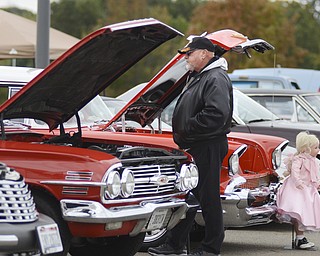 Katie Rickman | The Vindicator.Rick Shobel of Austintown looks at the antique cars at "Awesometown Oktoberfest" at the Township Park in Austintown on Sunday, Oct. 5, 2014.