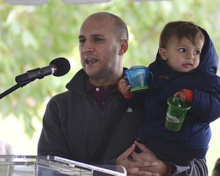 Katie Rickman | The Vindicator.Senator Joe Schiavoni holds his son Louie as he addresses the crowd gathered at the 5th Annual Nonviolence Parade on Sunday, Oct. 5, 2014. A rally followed the parade which traveled from Wood St. in Youngstown, down Wick Ave. and ended at the Covelli Centre.