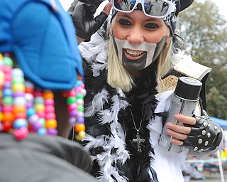 Jeff Lange | The Vindicator  Riley Rivera of Cleveland shows a child her face as she is dressed as famous pro wrestler Hulk Hogan during Sunday's Lawn-Con at B&O Station Park.