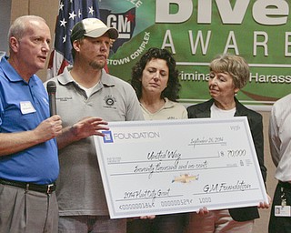        ROBERT K. YOSAY  | THE VINDICATOR..Bob Hannon with UNITED WAY    Jeremy WIlson (union rep) Karen Eusanio (union rep) Ginny Pasha United way Trumbull - and plant mgr Steve Notar Donato..GM is celebrating its 50th anniversary and they have invited us on the premises to celebrate and to see the 2015 Cruze...-30-