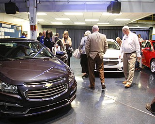        ROBERT K. YOSAY  | THE VINDICATOR..the new 2015 red white and blue Cruzes with the 1 million sign ...GM is celebrating its 50th anniversary and they have invited us on the premises to celebrate and to see the 2015 Cruze...-30-