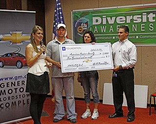        ROBERT K. YOSAY  | THE VINDICATOR..American Cancer Society with Erin Glista with the Cancer Society  Jeremy WIlson (union rep) Karen Eusanio (union rep) and plant mgr Steve Notar Donato..GM is celebrating its 50th anniversary and they have invited us on the premises to celebrate and to see the 2015 Cruze...-30-