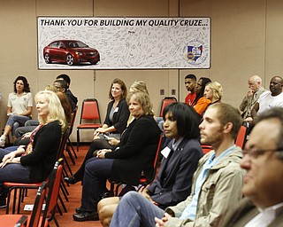        ROBERT K. YOSAY  | THE VINDICATOR..agencies and friends and dealers of GM LORDSTOWN crowd the media room for the annual giving of checks back  to the community..GM is celebrating its 50th anniversary and they have invited us on the premises to celebrate and to see the 2015 Cruze...-30-