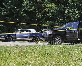        ROBERT K. YOSAY  | THE VINDICATOR..LIBERTY Ñ A man was shot and killed by police after a chase on state Route 11 just south of Tibbetts-Wick Road this morning..Lt.. Brian Holt of the Southington Barracks of the Ohio State Highway Patrol said deputies with the Trumbull County Sheriff's Office were chasing the vehicle, which was reported stolen, when troopers laid down stop sticks, which stopped the vehicle...-30-