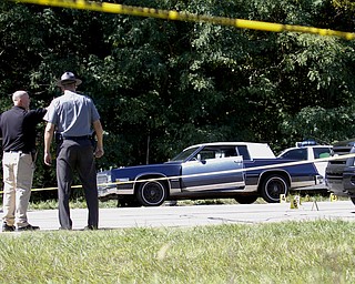        ROBERT K. YOSAY  | THE VINDICATOR..LIBERTY Ñ A man was shot and killed by police after a chase on state Route 11 just south of Tibbetts-Wick Road this morning..Lt.. Brian Holt of the Southington Barracks of the Ohio State Highway Patrol said deputies with the Trumbull County Sheriff's Office were chasing the vehicle, which was reported stolen, when troopers laid down stop sticks, which stopped the vehicle...-30-