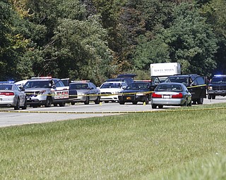        ROBERT K. YOSAY  | THE VINDICATOR..LIBERTY Ñ A man was shot and killed by police after a chase on state Route 11 just south of Tibbetts-Wick Road this morning..Lt.. Brian Holt of the Southington Barracks of the Ohio State Highway Patrol said deputies with the Trumbull County Sheriff's Office were chasing the vehicle, which was reported stolen, when troopers laid down stop sticks, which stopped the vehicle...-30-