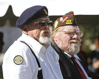        ROBERT K. YOSAY  | THE VINDICATOR..Veterans..James Oliver Sr  Rodney Bonsky  stand during the playing of their military service song..... The 6,000-square-foot, two-story building on Wick Avenue will house the YSU Office of Veterans Affairs and is designed to help improve and expand services to military veterans and service members transitioning to life as students at YSU....-30-
