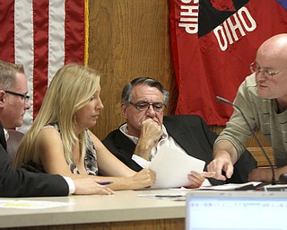 William D Lewis The Vindicator  Austintown Trustees from left : Jim Davis Lisa Oles and Ken Carano meet with zoning inspector Darren Crivelli(right) in executive session during a meeting 9-29-14 about rezoning.