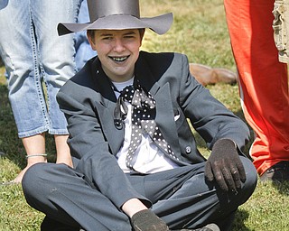        ROBERT K. YOSAY  | THE VINDICATOR..Derek Godfrey watches from shore as he team mates  "take the ""BAT BOAT"" across the lake"..The Annual Raider  Regatta done annually by 10th grade students at Memorial Park behind the old high School ...-30-