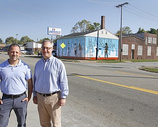        ROBERT K. YOSAY  | THE VINDICATOR..Two New Murals were shown today with the artists..  The area of Glenwood and Parkview where both buildings ( the former Park Inn and the LaFrance Building..part of YNDC - the Park Inn with Tommy Morgan formerly of Boardman - "face the future" and  La France with Jeremy Jarvis and the owner o fLaFrance Stephen Weiss...-30-