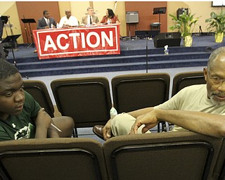 William D. Lewis The Vindicator Among those attending a seminar 9-30-14 at Metro Asembly Church in Youngstown about what to do if stopped by police were Jairus DuBose, 17, and his grandfather Mossco DuBose, both of Yougnstown.
