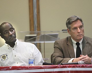 William D. Lewis The VindicatorFormer YPD Chf Jimmy hughes, left, and Chief Robin Lees listen during a seminar about what to do if stopped by police were Jairus DuBose, 17, and his grandfather Mossco DuBose, both of Yougnstown.