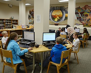 Katie Rickman | The VindicatorSixth graders at Poland McKinley Elementary School work on computers in the library at the school on Monday, October 6, 2014.  Poland Elementary School students use computers to do math and language arts homework and tests.
