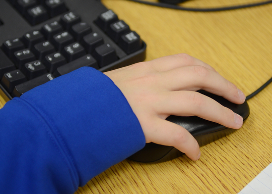 Katie Rickman | The Vindicator.A student uses a computer mouse while working on math problems in the library at the school on Monday, October 6, 2014.  Poland Elementary School students use computers to do math and language arts homework and tests.