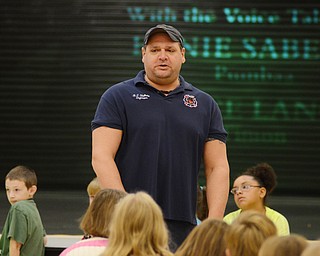 Katie Rickman | The Vindicator.Brian Stellato a fire fighter with Struthers Fire Department speaks to 3rd and 4th graders at Struthers Elementary school about fire safety on Tuesday, Oct. 7, 2014. The students were able to ask questions about how to react if there were a fire.