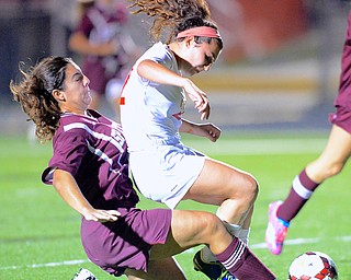 Jeff Lange | The Vindicator  Canfield sophomore Anita Mancini and Boardman's Camille Holzschuh colide in the first half as they fight for the ball, Monday night during their matchup in Canfield.