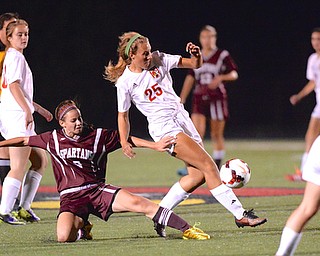 Jeff Lange | The Vindicator  Boardman's Payton Bryant (9) slides in attempt to steal the ball away from Canfield's Heather Haley (25) during second half action at Bob Dove Field in Canfield.