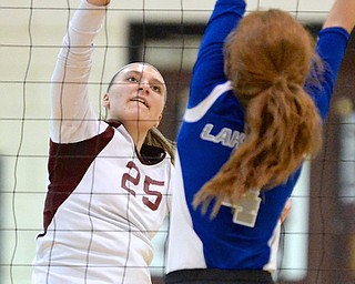 Jeff Lange | The Vindicator  Boardman's Amber McMillan (25) spikes the ball over the net into the defense of Lakeview's Whitney Winch, Tuesday night at Boardman High School.