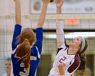 Jeff Lange | The Vindicator  Hope Sanders of Boardman spikes the ball over the net as Lakeview's Alania Lytle jumps to defend during Tuesday night's matchup in Boardman.