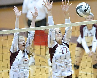 Jeff Lange | The Vindicator  Boardman's Katie Platt (left) and Amanda Lipke (right) go up to defend a spike during Tuesday evening's game in Boardman against the Lakeview Bulldogs.