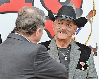 Jeff Lange | The Vindicator  Veteran Thomas Ducharme (facing) speaks with Senator Sherrod Brown after receiving awards for his service in the Army during the Vietnam War, Monday morning in Warren.