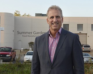 Katie Rickman | The Vindicator.Tom Zidian CEO of Gia Russa and Summer Garden Food Manufacturing poses for a photo outside of the plant in Boardman Wednesday, October, 1, 2014. The local business man has manufactured many sauces for celebrities including Mario Batali, Guy Fieri, and George Foreeman.