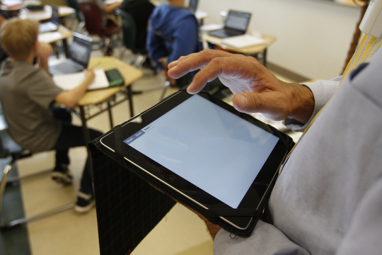        ROBERT K. YOSAY  | THE VINDICATOR..South Range Schools with Superintendent .Dennis Dunham.. has used a varitey of new educational tools to increase learning and decrease costs saving over 70000 dollars.... .Math Teacher Jeff Hammond uses a net  book in his class ..-30-