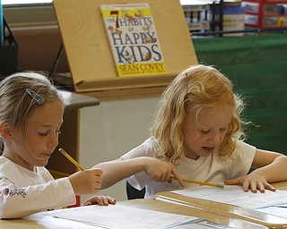        ROBERT K. YOSAY  | THE VINDICATOR..South Range Schools with Superintendent .Dennis Dunham.. has used a varitey of new educational tools to increase learning and decrease costs saving over 70000 dollars....Quincy Bailey and Nevaeh Jacson work as a team on a project ...-30-