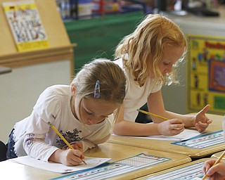        ROBERT K. YOSAY  | THE VINDICATOR..South Range Schools with Superintendent .Dennis Dunham.. has used a varitey of new educational tools to increase learning and decrease costs saving over 70000 dollars....Quincy Bailey and Nevaeh Jacson work as a team on a project ...-30-