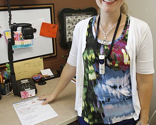        ROBERT K. YOSAY  | THE VINDICATOR..South Range Schools with Superintendent .Dennis Dunham.. has used a varitey of new educational tools to increase learning and decrease costs saving over 70000 dollars.... Lisa Fullerton uses a smart board and "elmo document projector" to teach and have students interact easily..-30-