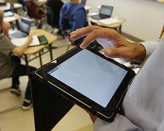        ROBERT K. YOSAY  | THE VINDICATOR..South Range Schools with Superintendent .Dennis Dunham.. has used a varitey of new educational tools to increase learning and decrease costs saving over 70000 dollars.... .Math Teacher Jeff Hammond uses a net  book in his class ..-30-