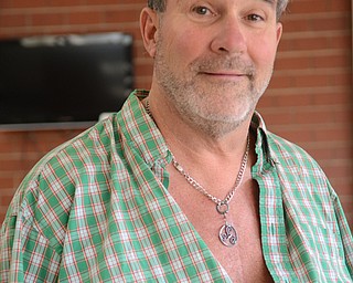 Katie Rickman | The Vindicator.Tom Lawrence of Boardman is currently on a heart transplant waiting list at Cleveland Clinic and until he receives his heart he wears a L-VAD heart pump that keeps his heart going. He works out frequently, despite his heart condition, at the YMCA  in Youngstown Thursday, Oct. 2, 2014.