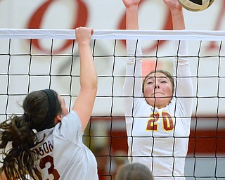 Jeff Lange | The Vindicator  Cardinal Mooney's Gina Patella (20) hits Boardman's Krista Johnson's shot back over the net during play at Mooney High School, Wednesday night.