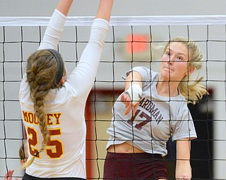Jeff Lange | The Vindicator  Boardman's Amanda Lipke (17) spikes the ball past Mooney's Nichole Webber during their third game, Wednesday evening at Mooney High School.