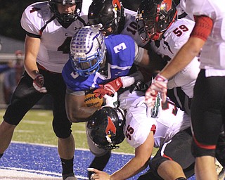 William D Lewis The Vindicator  Hubbard's LJ Scott(3) drags a host of Canfield defendersd into the endzone to score a 1rst qtr TD during 10102014 action in Hubbard.