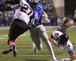 William D Lewis The Vindicator  Hubbard's George Hill (4) is stopped by Canfield'sJohn French(27) during 10102014 astion in Hubbard. Canfield's Jordan Brown tries to make the tackle.