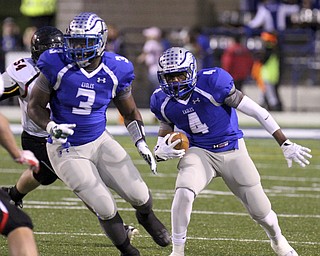 William D Lewis The Vindicator  Hubbard's George Hill(4) moves downfield while LJ Scott(3)blocks during 10102014 action in Hubbard.