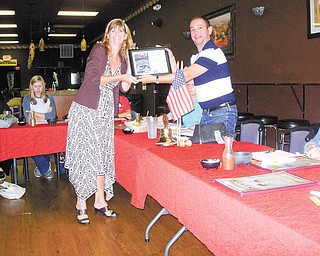 SPECIAL TO THE VINDICATOR
At the Sept. 11 meeting of Boardman Lions, Pat DeAscentis, representative for Project Linus, accepted a donation of $500. The organization makes blankets to distribute to at-risk newborns. Boardman Center Middle School PANDA organization also received a $500 donation. PANDA encourages responsible decisions about bullying, depression, violence, self-esteem and other issues. Above, Mandy DiPietro, PANDA coordinator, presented Matt Gambrel, Boardman Lions vice president, with a certificate of appreciation for the Lions Club support over the past few years.