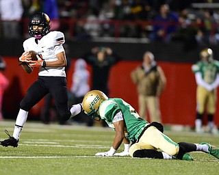 YOUNGSTOWN, OHIO - OCTOBER 10, 2014: Jeff Koch #1 of Massillon runs with the football after intercepting a pass tipped by David Collins #20 of Ursuline during the 1st half of Friday nights OHSAA game at Stambaugh Stadium. (Photo by David Dermer/Youngstown Vindicator)
