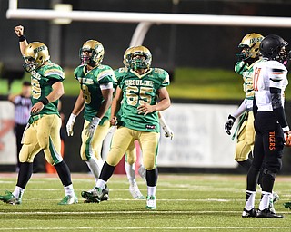 YOUNGSTOWN, OHIO - OCTOBER 10, 2014: Vito penza #39 of Ursuline of Massillon celebrates after a Massillon field goal attempt sailed wide right late in the 4th quarter during the 2nd half of Friday nights OHSAA game at Stambaugh Stadium. (Photo by David Dermer/Youngstown Vindicator) Ursuline Deion Edwards #8, Devin Matthews #65, Jabbar price #52 and Massillon Montrell Stevens #17 pictured.