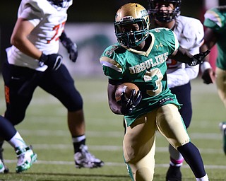 YOUNGSTOWN, OHIO - OCTOBER 10, 2014: Kimauni Johnson #3 of Ursuline runs the football in the open field after running past the Massillon defense during the 1st half of Friday nights OHSAA game at Stambaugh Stadium. (Photo by David Dermer/Youngstown Vindicator)
