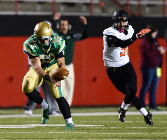 YOUNGSTOWN, OHIO - OCTOBER 10, 2014:Vito Penza #39 of Ursuline drops a would be interception after jumping the pass intended for Dylan Henderson #9 of Massillon during the 1st half of Friday nights OHSAA game at Stambaugh Stadium. (Photo by David Dermer/Youngstown Vindicator)