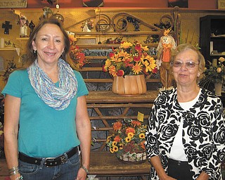 SPECIAL TO THE VINDICATOR
Garden Forum of Greater Youngstown's Holiday flower show will take place Nov.1. Joy Mascher, owner and designer of Flowers Straight From The Heart in East Palestine is at left, and at right is Sheila Bowman, chairwoman and president of Nature Lovers Garden Club, the hostess club.