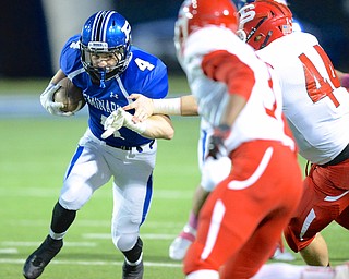 Jeff Lange | The Vindicator  Poland junior Dylan Garver returns a kick into a host of Wildcat defenders early in the first quarter at Dave Pavlansky Field, Friday night.