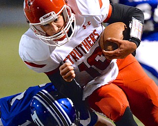 Jeff Lange | The Vindicator  Struthers' AJ Musolino is tackled out of bounds by Poland's Marty Malenic (11) during first half action in Poland, Friday evening.