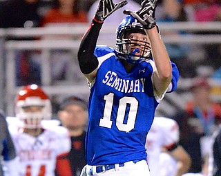 Jeff Lange | The Vindicator  Bulldogs' Tate Duarte looks to make a catch in first half action, Friday night against the Struthers Wildcats in Poland.