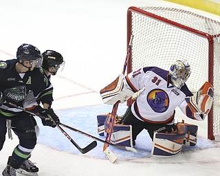 William D Lewis The Vindicator Phantoms goalieCollin DeAugustine(31) blocks a shot from ThundersMatt Mendelson(21) and Vince Pedrie(24)during 10-10-14 game with Bloomington Thunder.