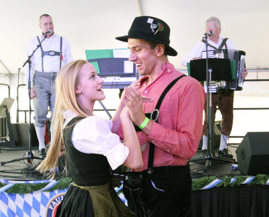 William D Lewis the vindicator Auggie Heschmeyer and Heather Foust, both of Youngstown dance a polka to the sounds of Eintracht, a Mahoning Valley based band that plays German music during Oktoberfest Youngstown at Kravitz Deli in Liberty Sunday.
